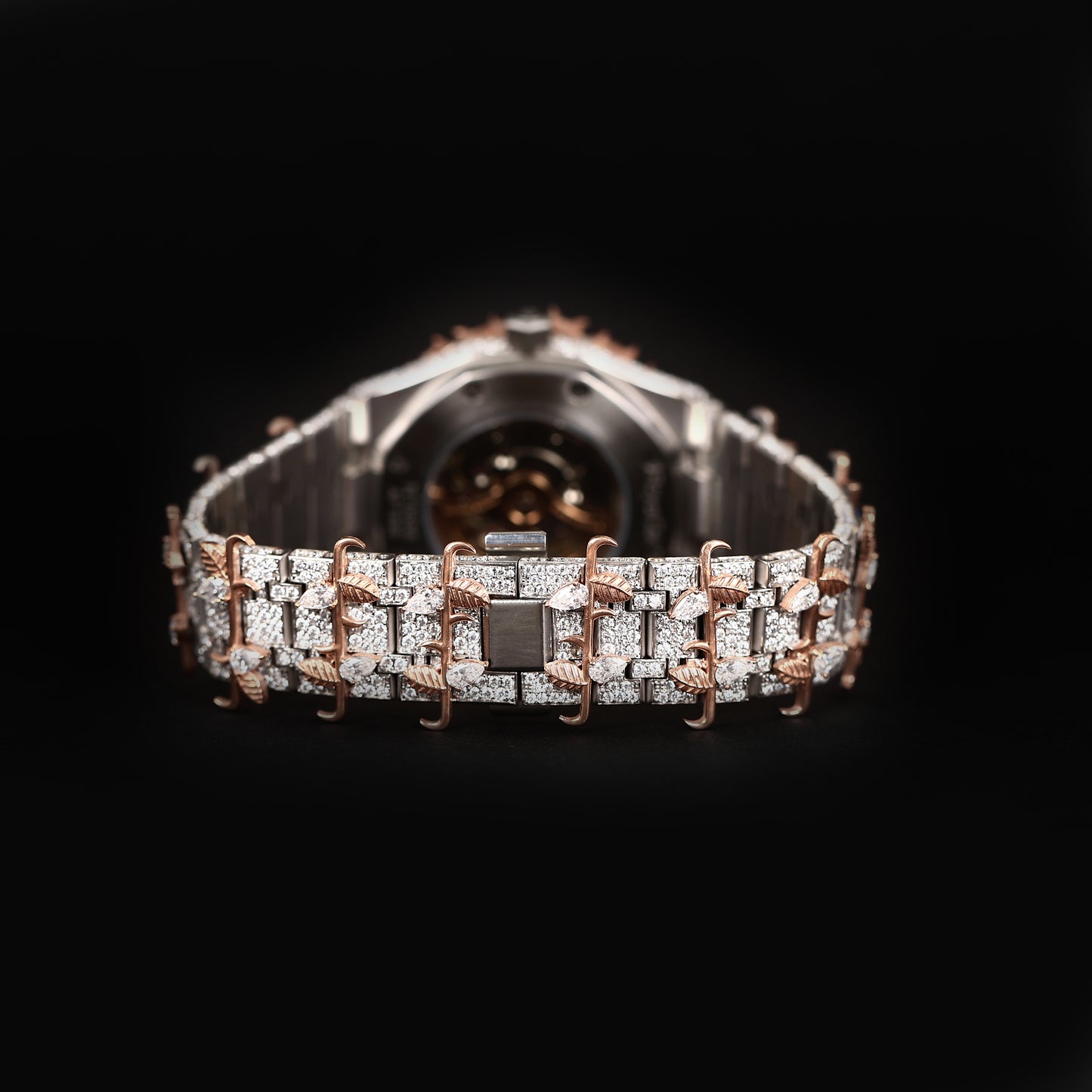 luxury wristwatch with iced dial and bold designer style bracelet