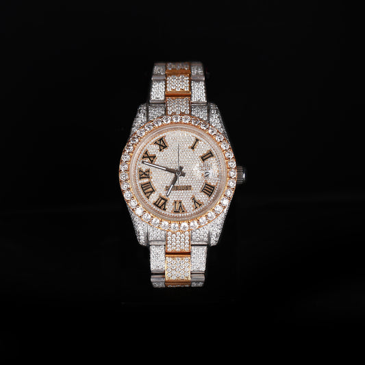 white and yellow iced out watch with roman numeral dial and full diamond shine