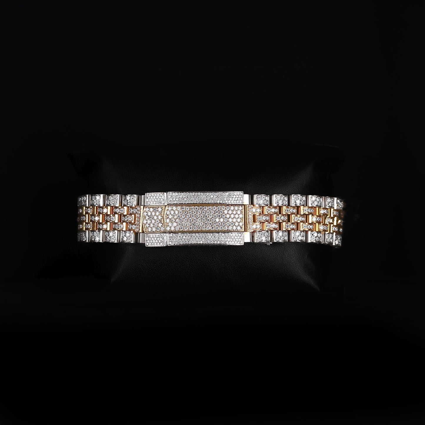 white and yellow wristwatch with diamond style stones and bold luxury look