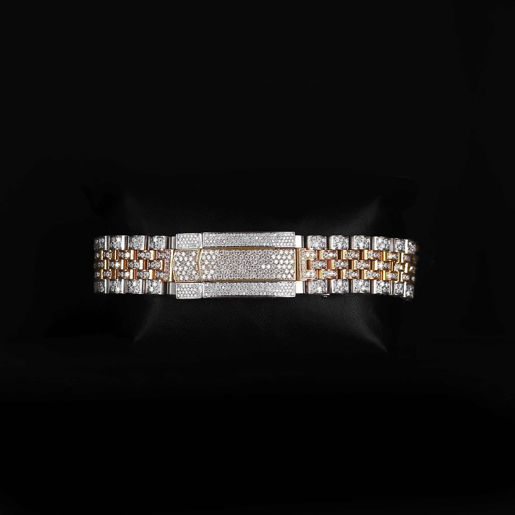 white and yellow wristwatch with diamond style stones and bold luxury look
