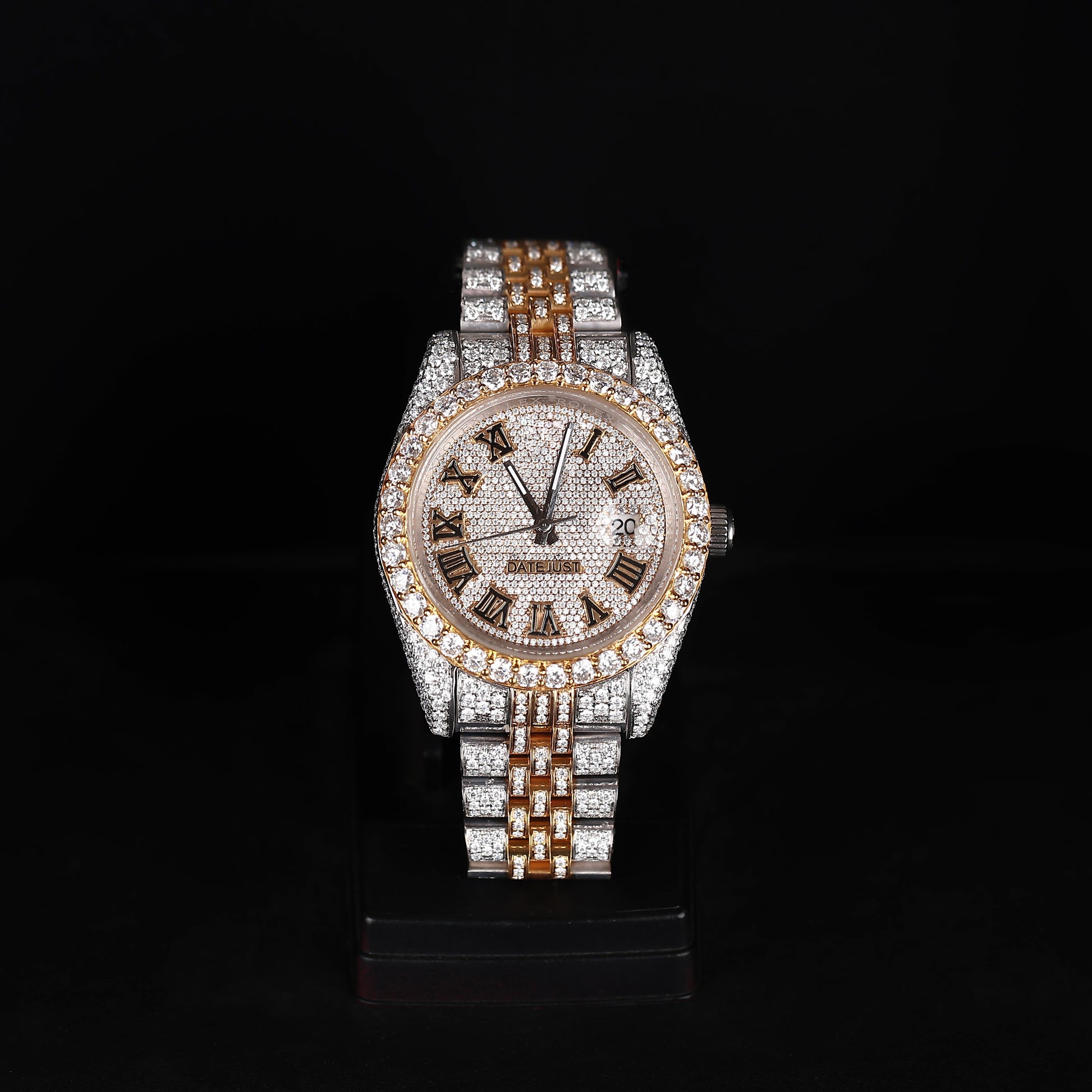 white and yellow iced out watch with roman numeral dial and full diamond shine