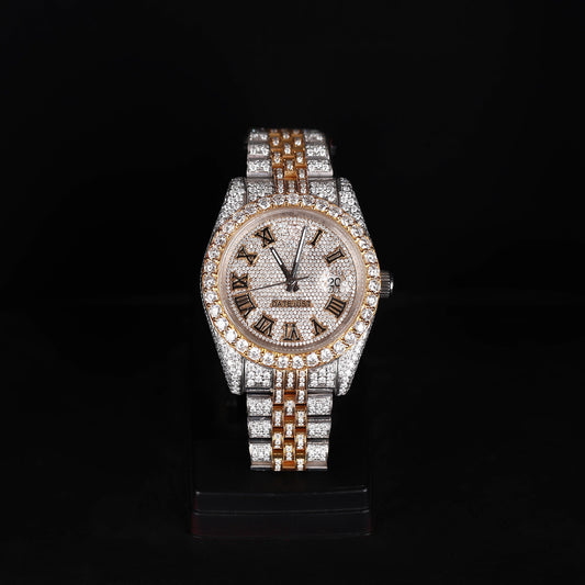 white and yellow iced out watch with roman numeral dial and full diamond shine