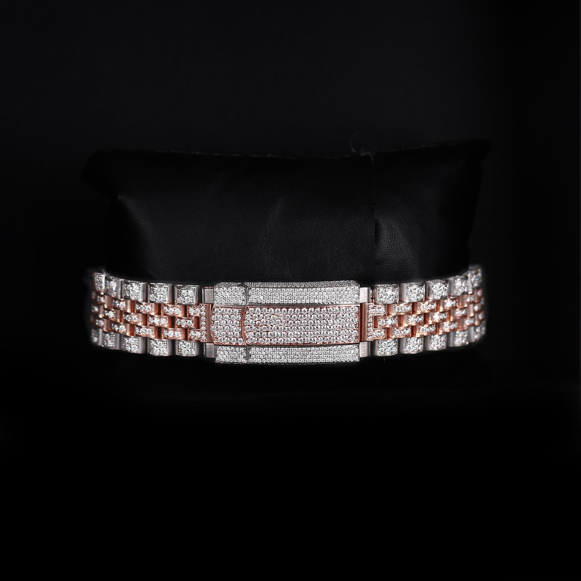 automatic luxury watch with full iced bracelet and roman dial close up