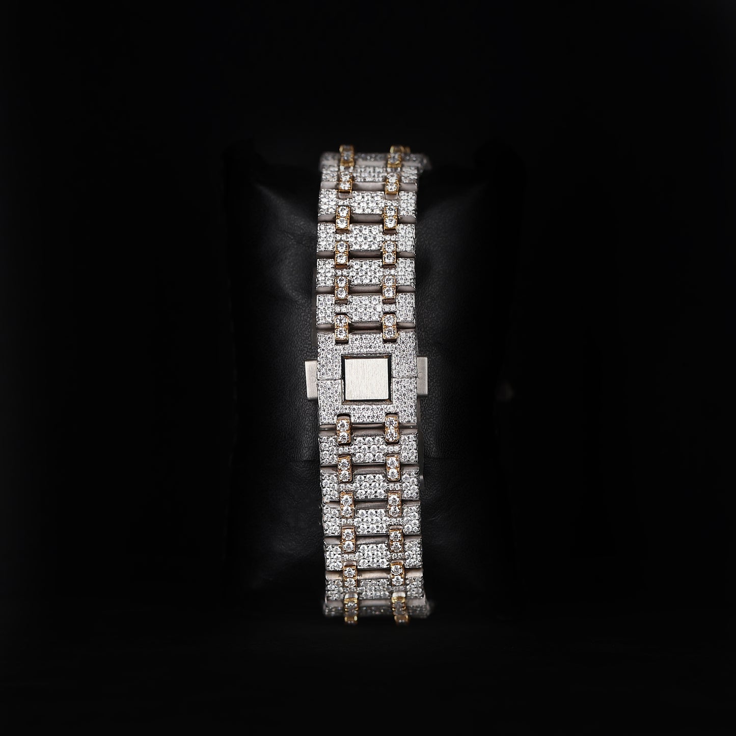 automatic skeleton wristwatch with iced bezel and exposed movement