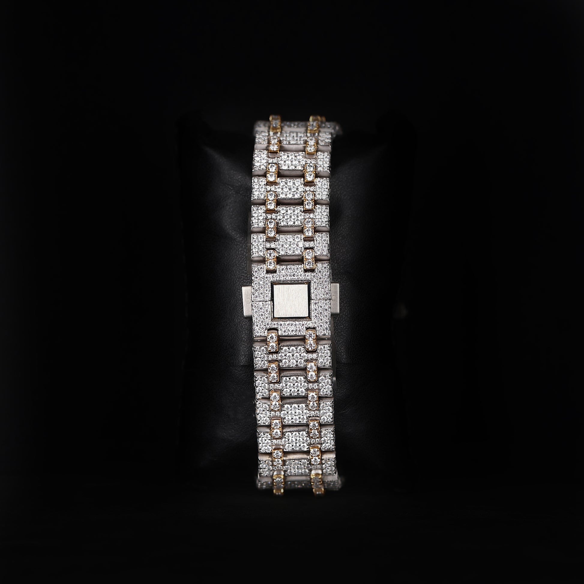 automatic skeleton wristwatch with iced bezel and exposed movement