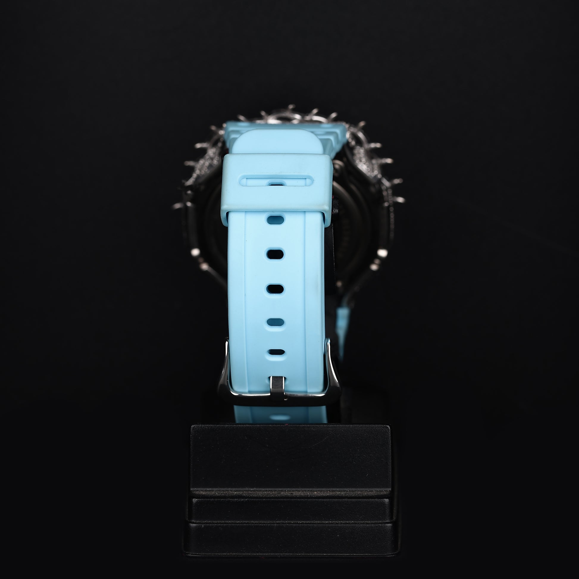 iced statement wristwatch with aqua color and spiked luxury bezel