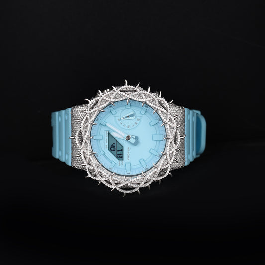 luxury moissanite watch with blue strap and unique spiked bezel