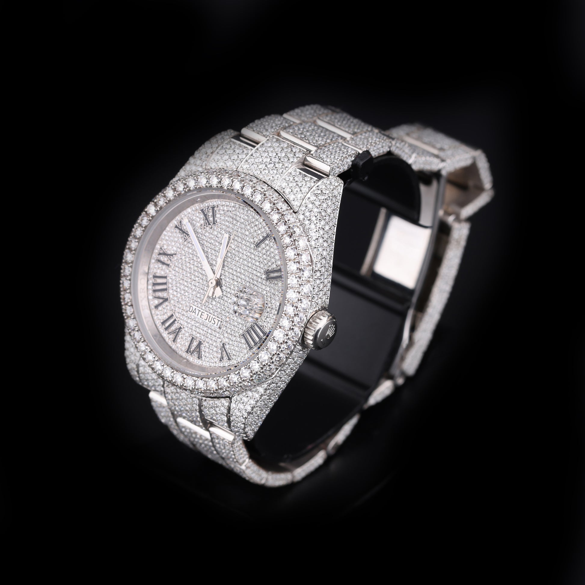 automatic luxury watch with full stone setting and round dial close up