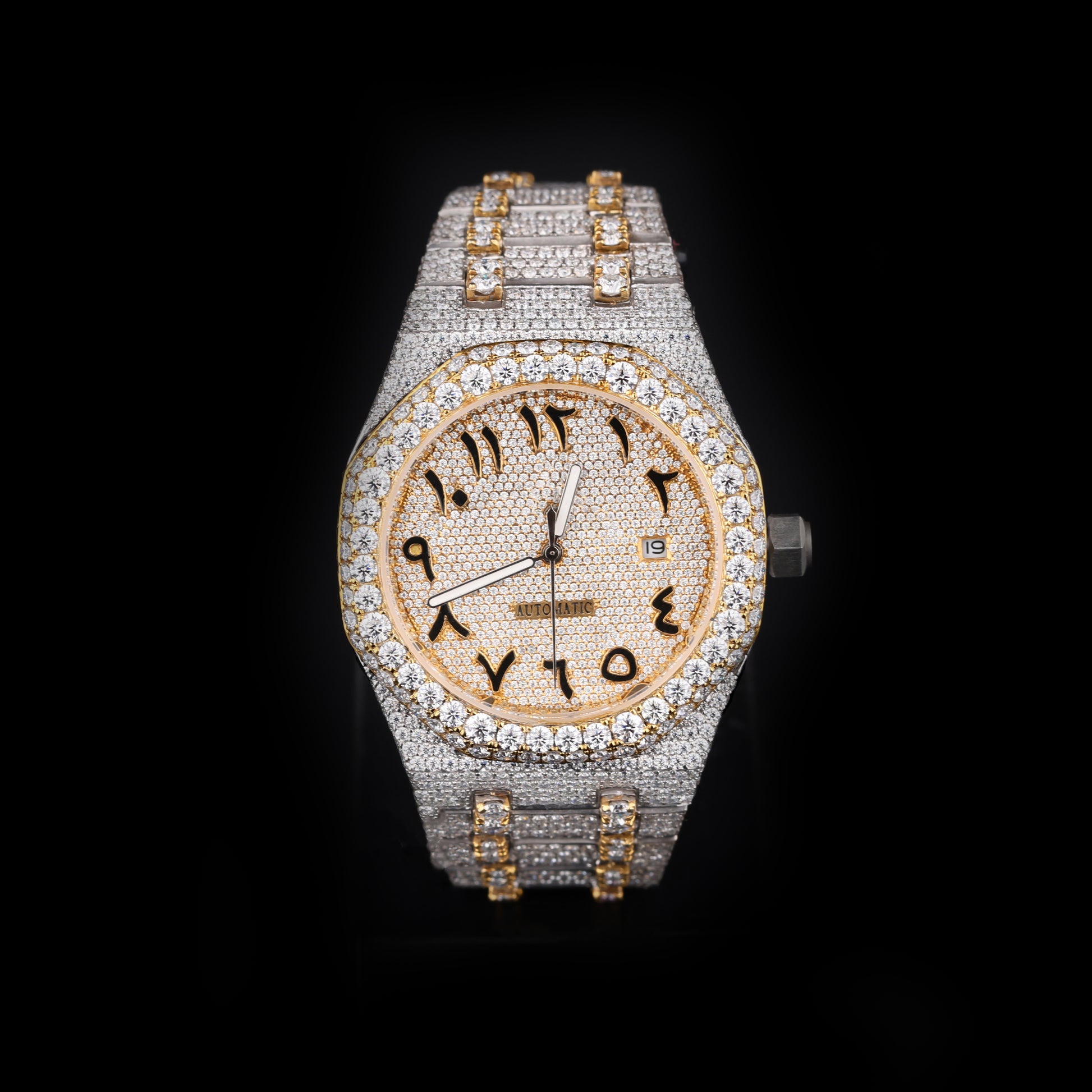 white and yellow iced out watch with arabic numeral dial and full diamond shine