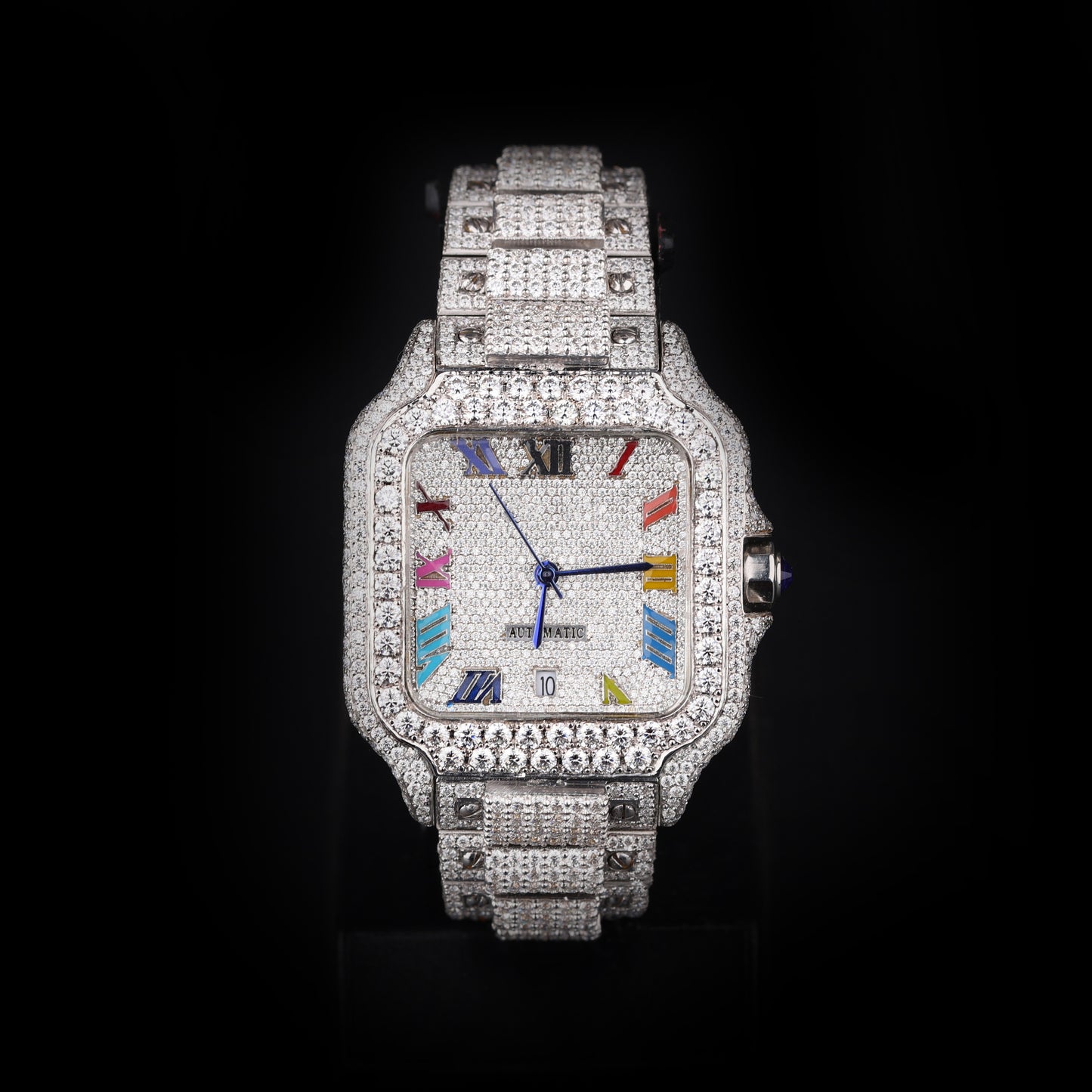 white iced out watch with multi color roman numeral dial and full diamond shine
