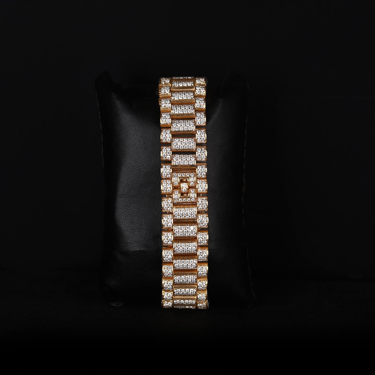white and yellow wristwatch with diamond style stones and blue dial finish