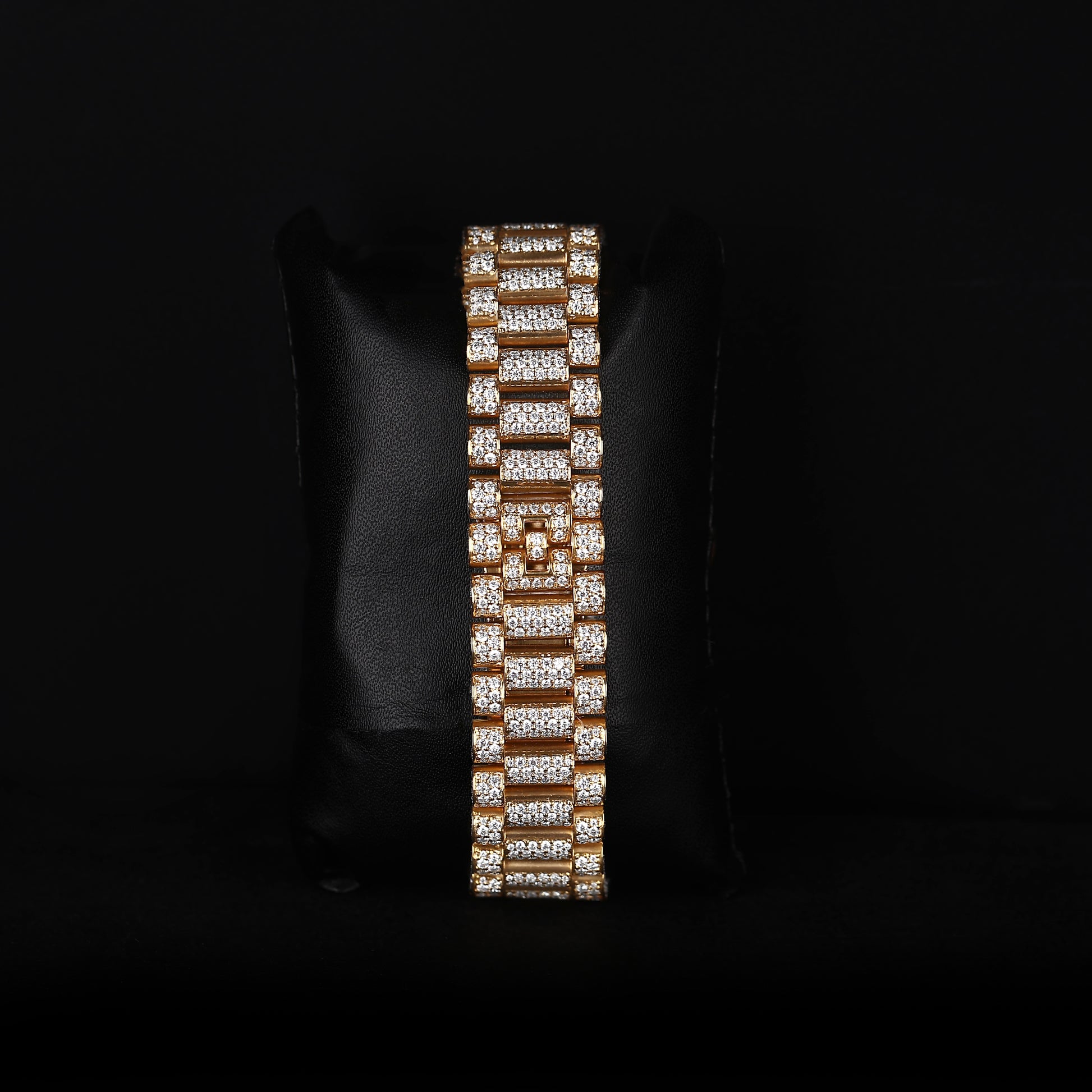 white and yellow wristwatch with diamond style stones and blue dial finish