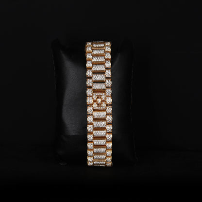 white and yellow wristwatch with diamond style stones and blue dial finish