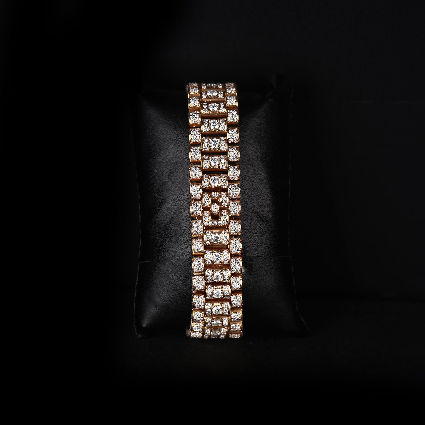 yellow wristwatch with diamond style stones and premium gold dial finish