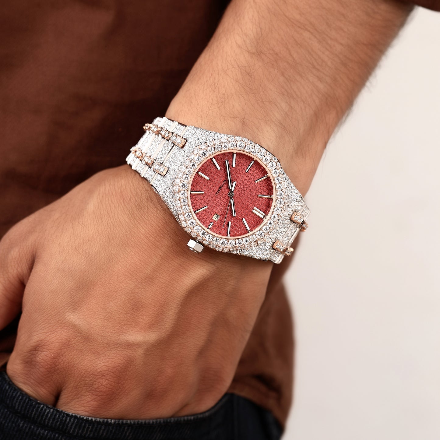 statement luxury watch with diamond setting and red dial
