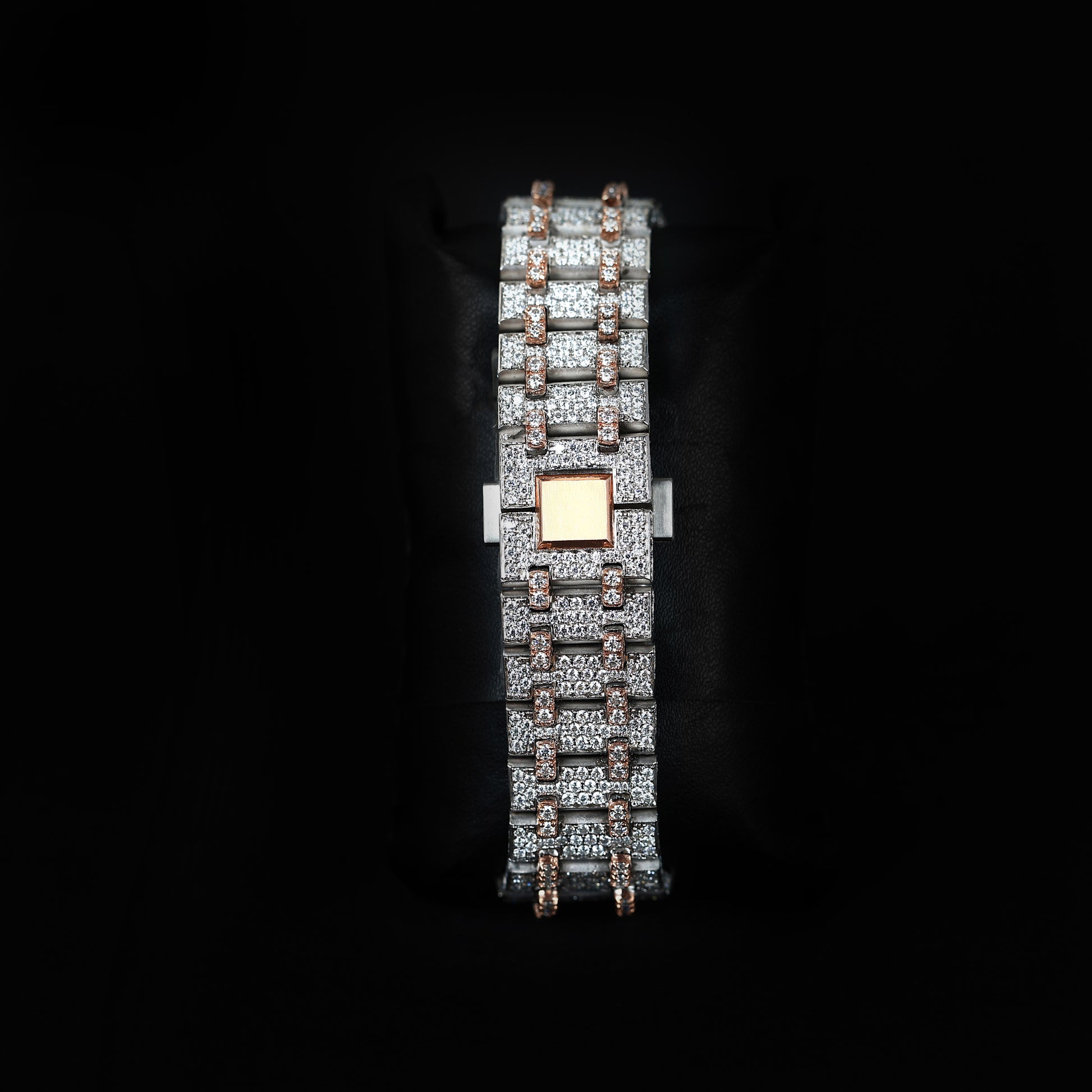 iced bezel wristwatch with red dial and luxury design