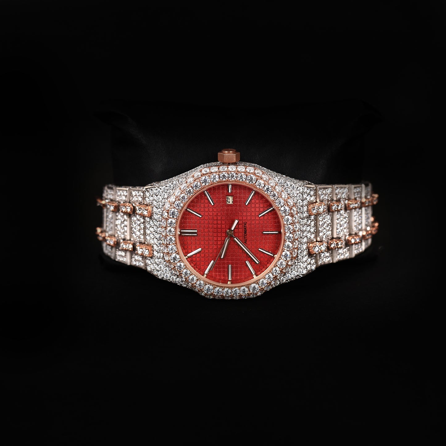 premium automatic watch with red face and fully iced bracelet