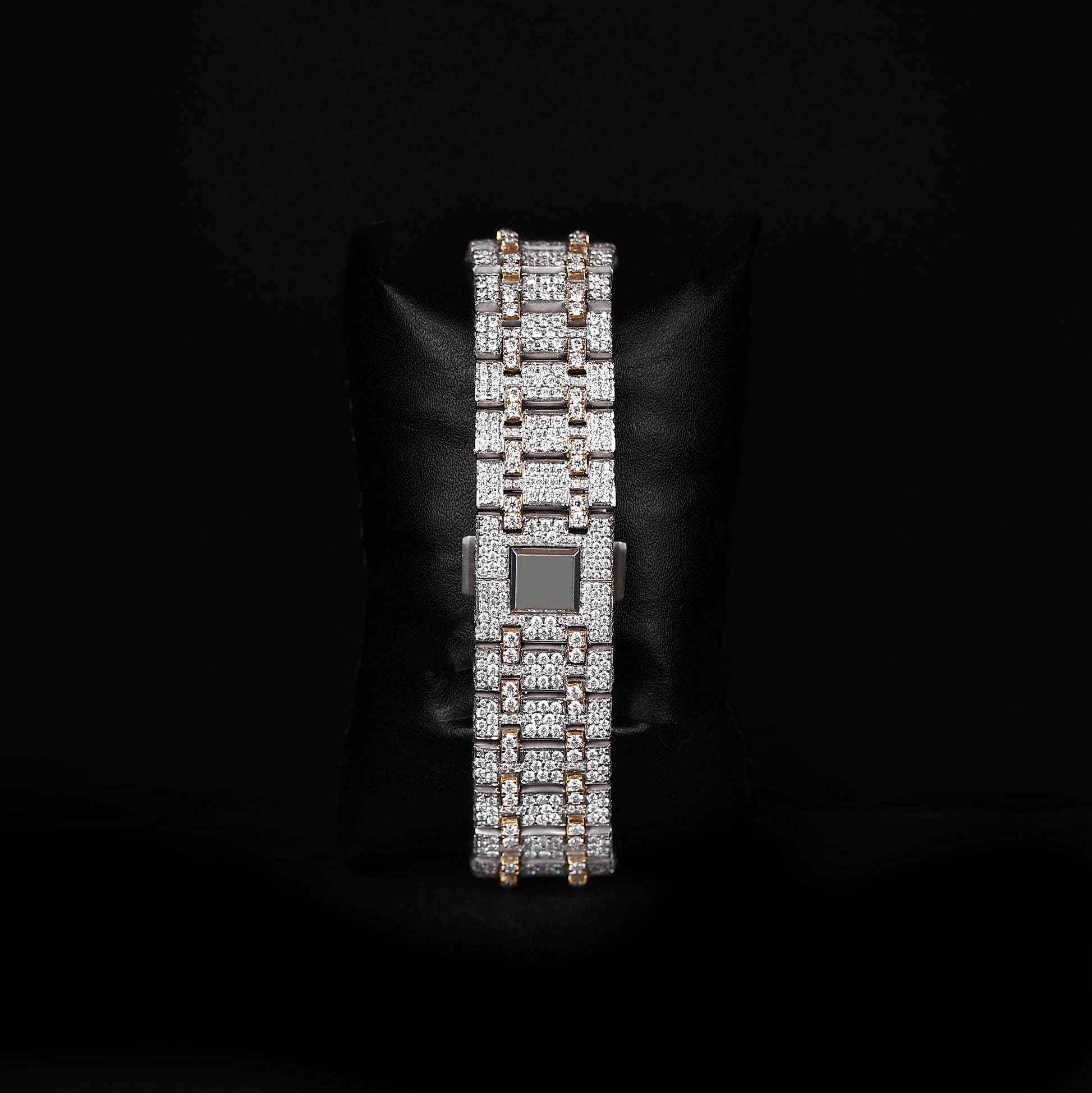 white and yellow wristwatch with diamond style stones and strong premium shine