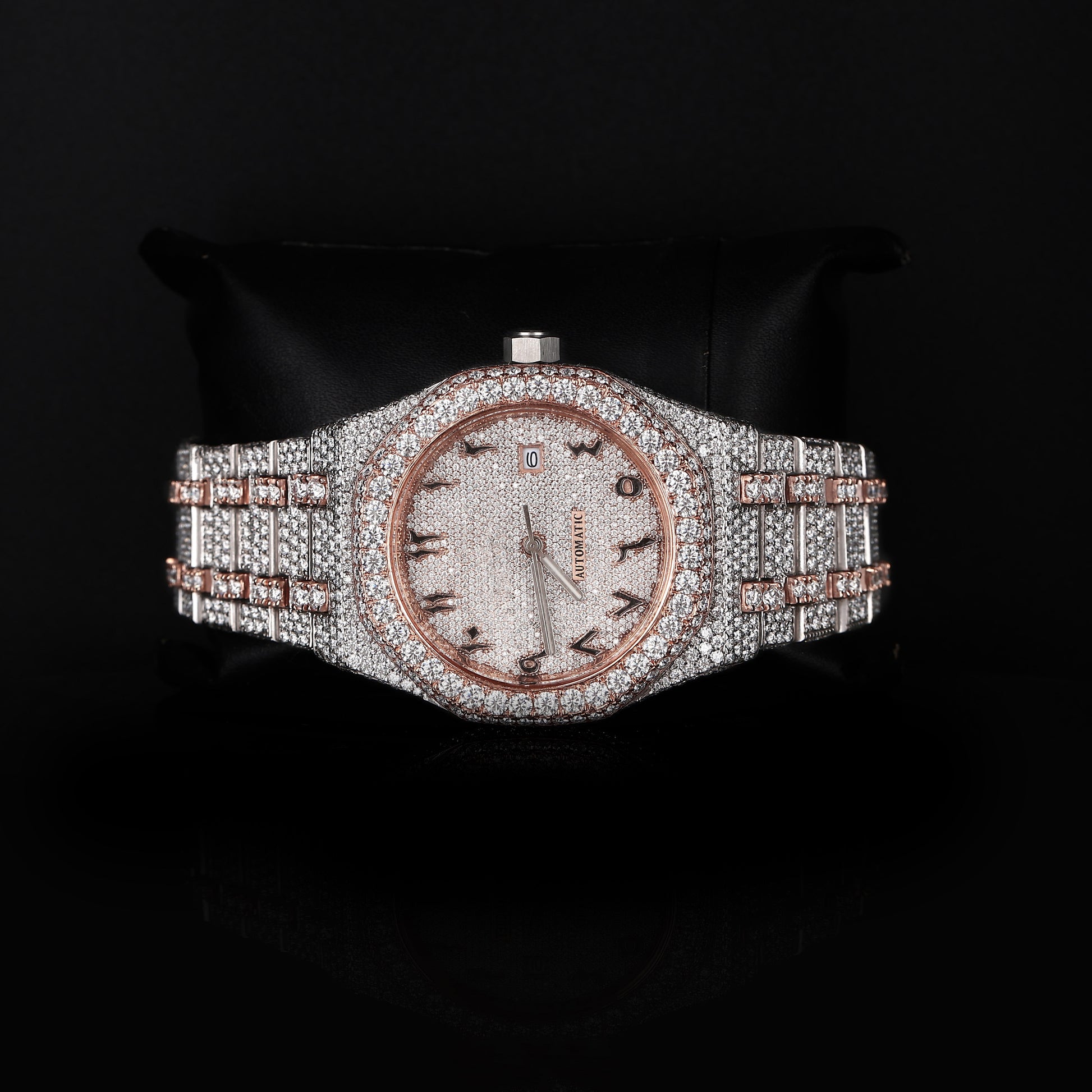 automatic luxury watch with full iced bracelet and round dial close up