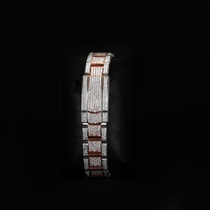 iced bezel wristwatch with two tone finish and elegant dial