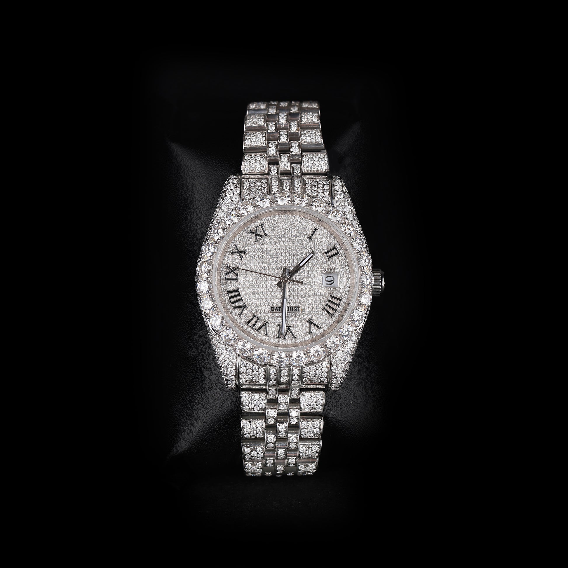 white iced out watch with roman numeral dial and full diamond shine luxury style
