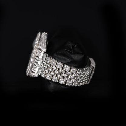 automatic luxury watch with full stone setting and round dial close up