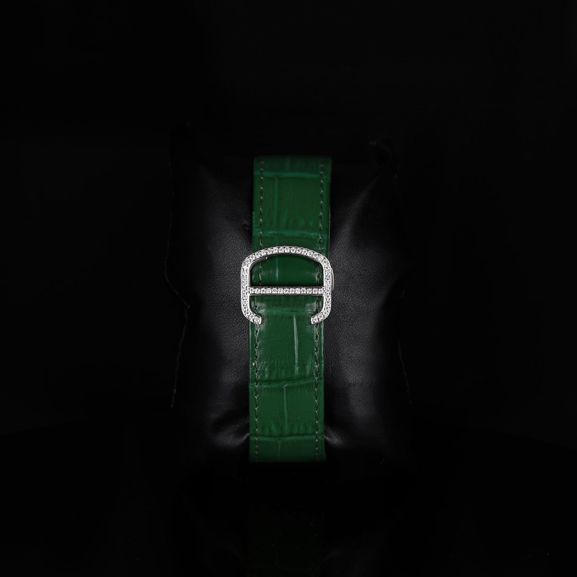 premium square wristwatch with iced bezel and green dial accents