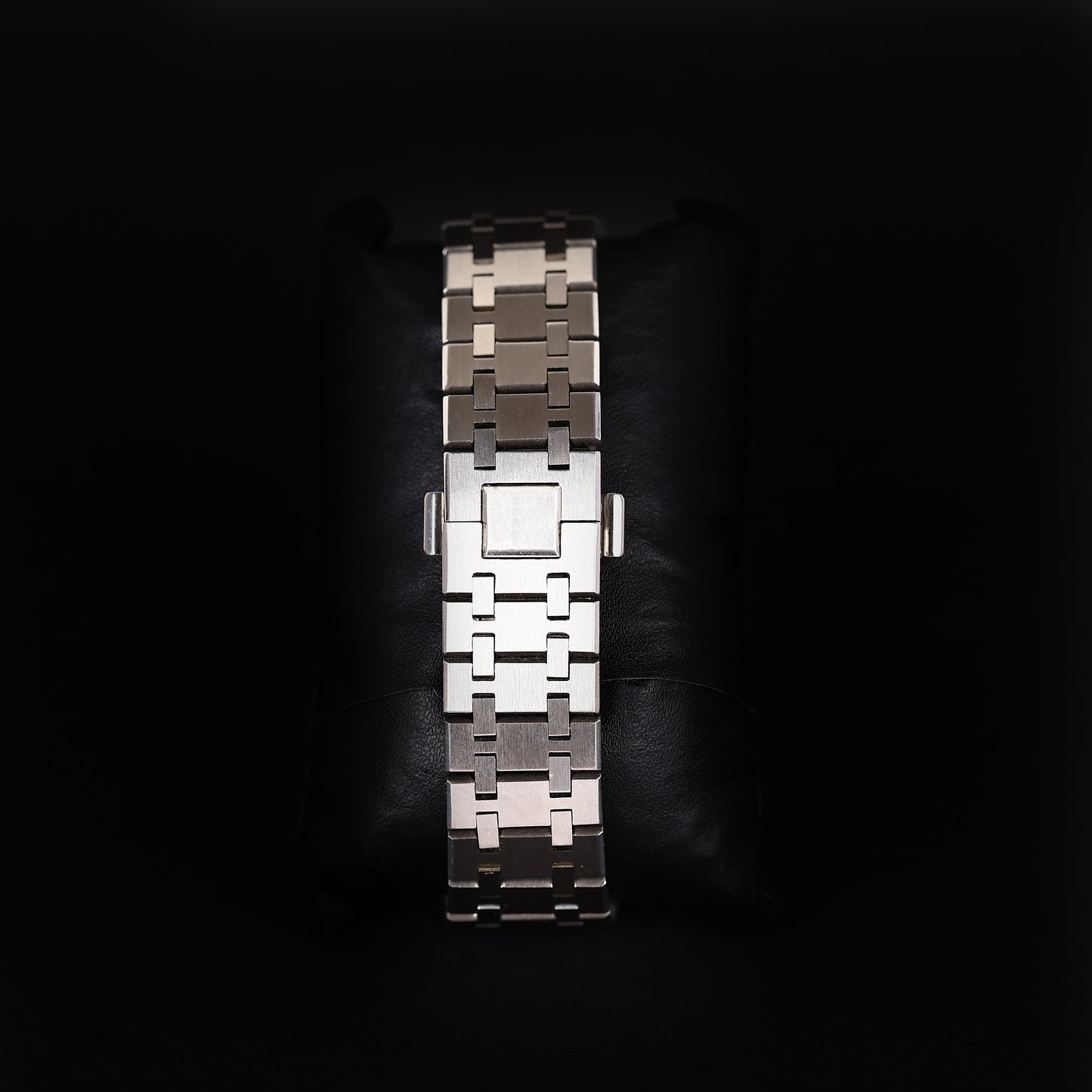 iced bezel watch with transparent skeleton design and steel strap