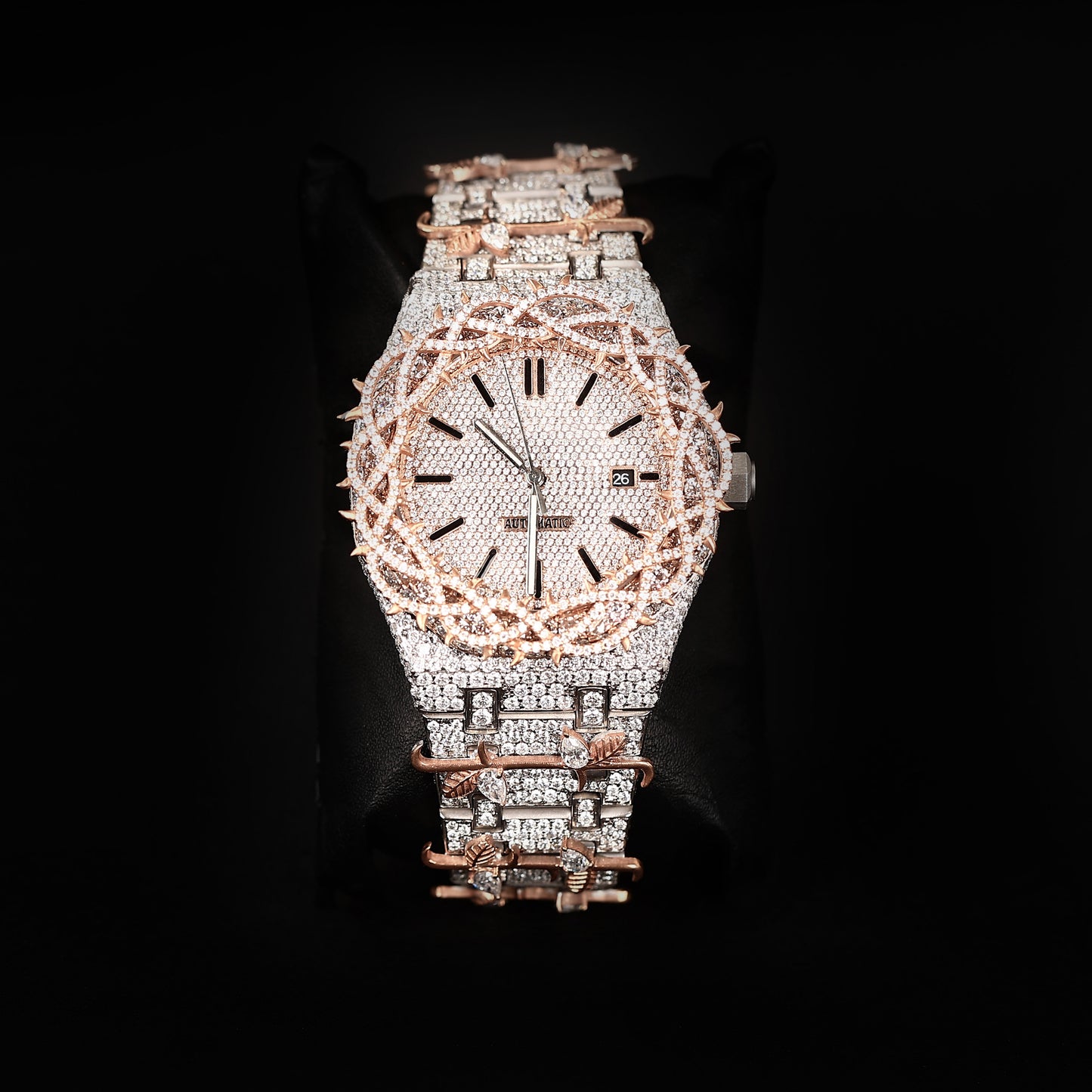 luxury iced two tone watch with rose accents and diamond covered dial